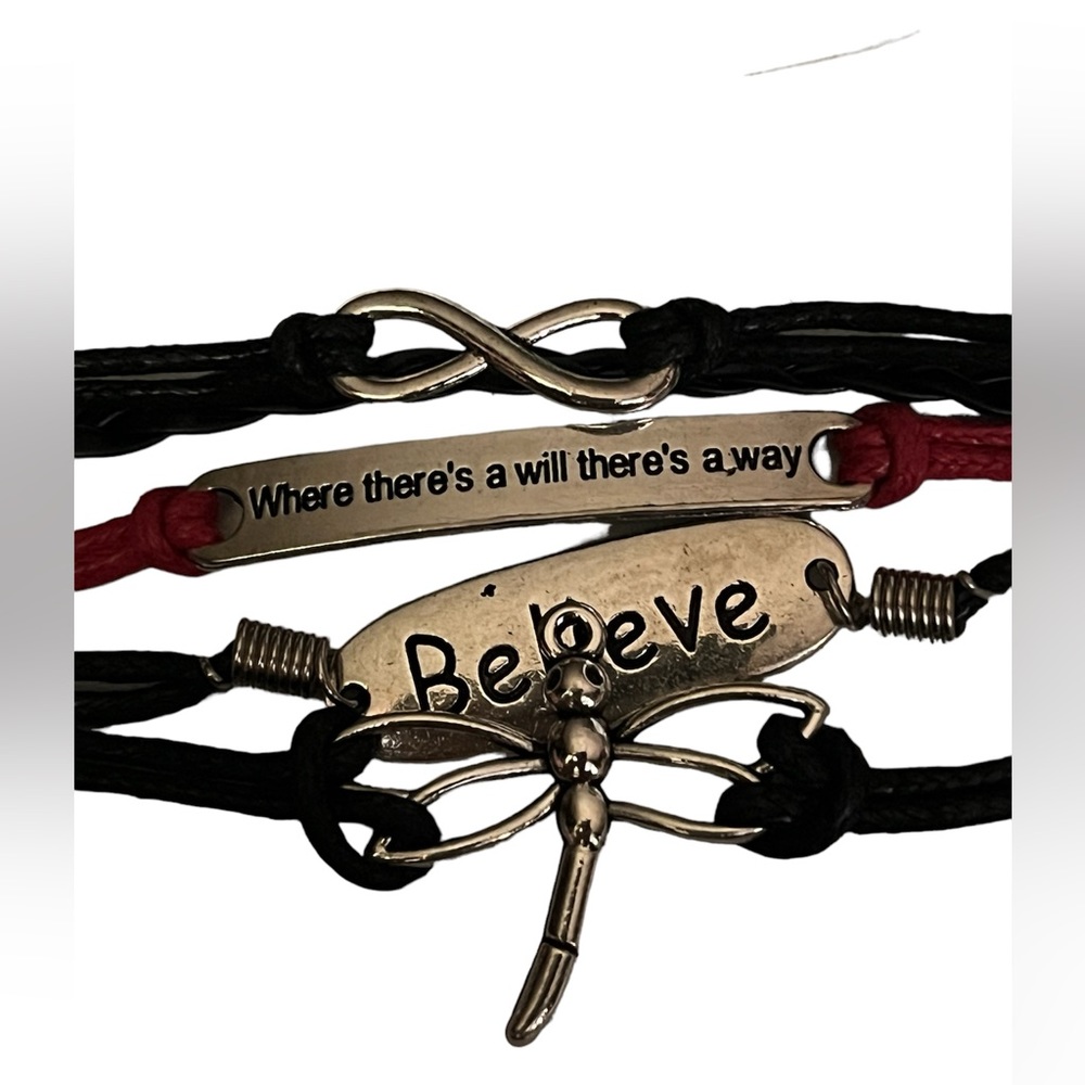 Brand New in Package corded bracelet cute charms.  also come with extra happies